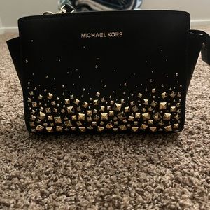 Black and gold Michael Kors handbag